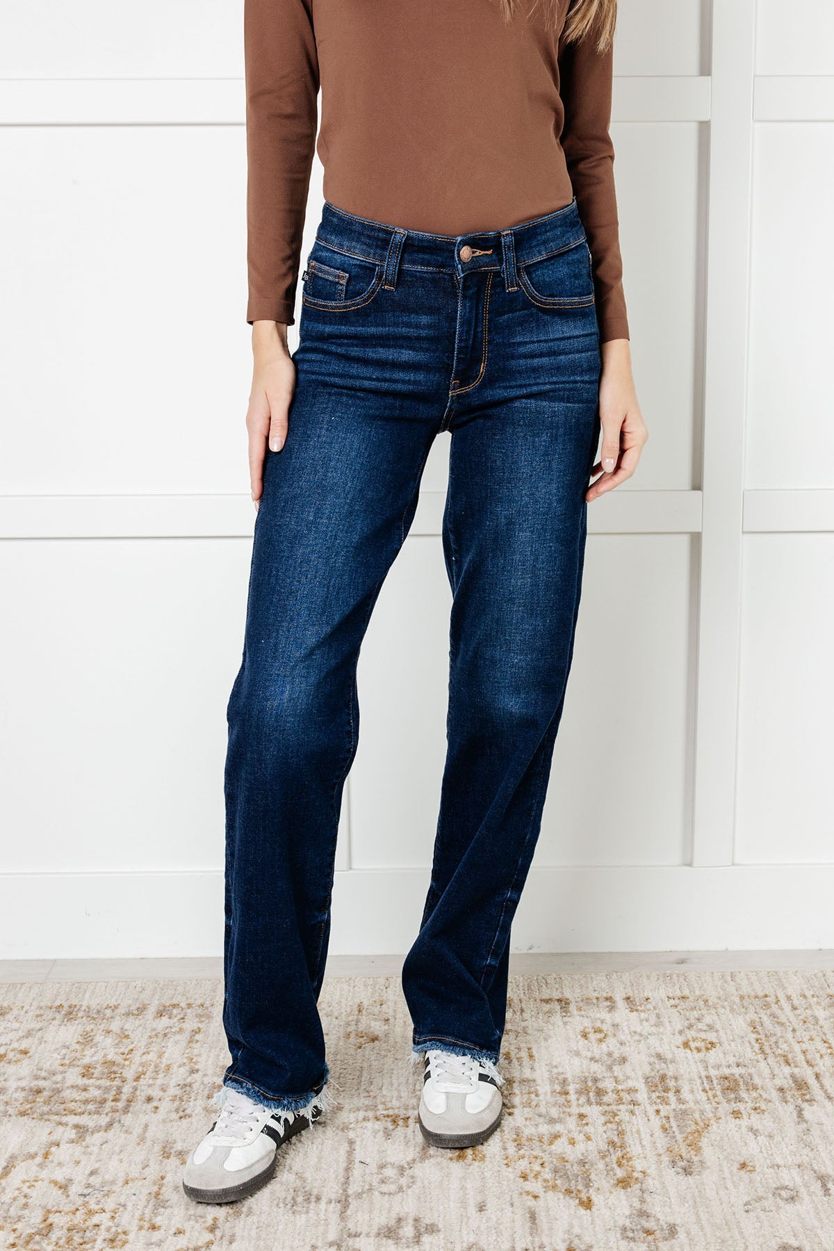 The Jacqueline Mid Rise Jean will elevate your casual look with its dark wash and non-distressed design. The straight leg silhouette flatters any figure, while the frayed hem adds a touch of playful flair. Perfect for any occasion, this jean is a must-have for your wardrobe.

Judy Blue
Mid Rise
Zip Fly
Dark Wash
Straight Leg Silhouette
Raw Hem
93% Cotton, 6% Polyester, 1% Spandex
True to Judy Blue Sizing