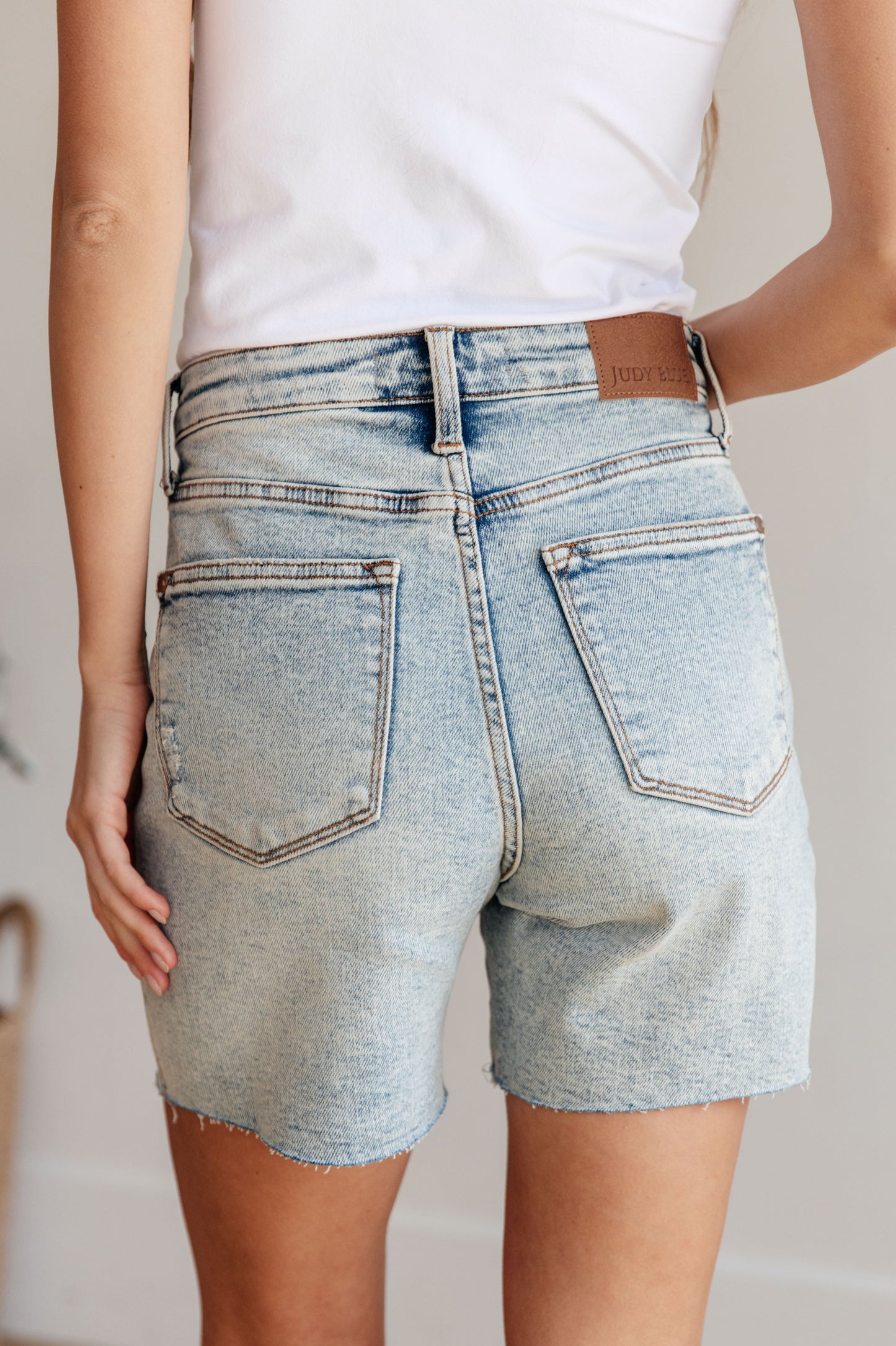 Get ready for some playful vibes with our Cindy High Rise Mineral Wash Distressed Boyfriend Shorts from Judy Blue! Featuring a high rise, comfort fit and 4-way stretch for maximum mobility. The mineral wash and cut off hem add a unique touch to these versatile shorts. Perfect for any day out (or in)! S-3X