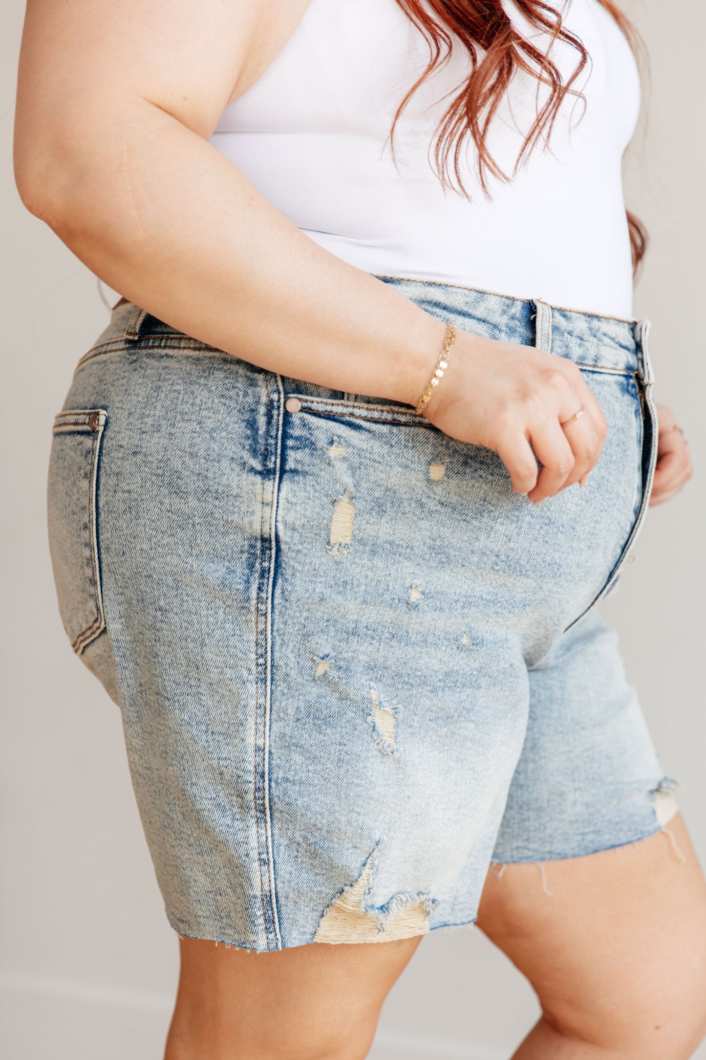 Get ready for some playful vibes with our Cindy High Rise Mineral Wash Distressed Boyfriend Shorts from Judy Blue! Featuring a high rise, comfort fit and 4-way stretch for maximum mobility. The mineral wash and cut off hem add a unique touch to these versatile shorts. Perfect for any day out (or in)! S-3X