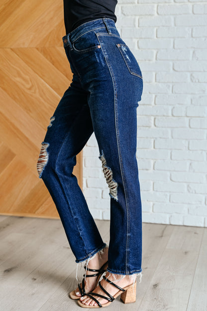 Experience the perfect blend of comfort and style with our Montana High Rise Rigid Magic Distressed Straight Jeans from Judy Blue! The high rise design and rigid magic construction provide a relaxed and flattering fit, while the dark wash and distressed details add a bit of edginess. Complete your look with these effortlessly cool jeans.