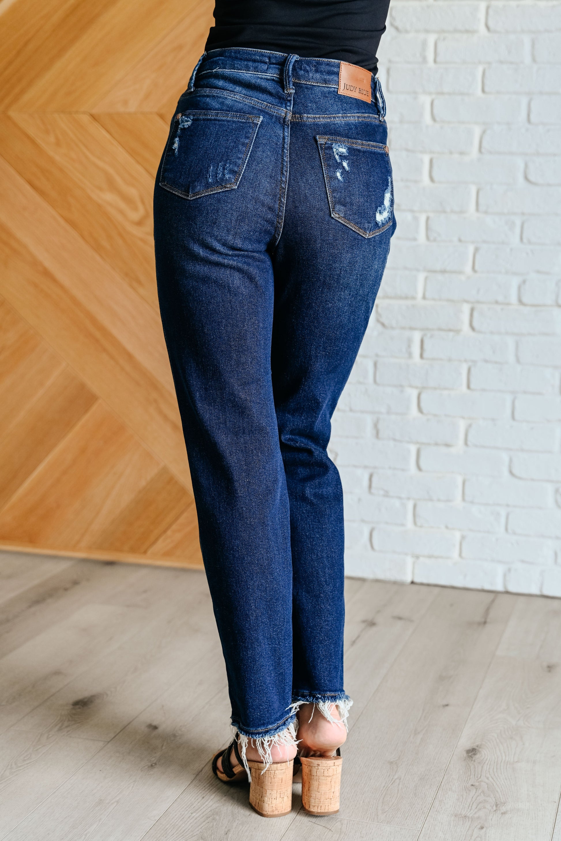 Experience the perfect blend of comfort and style with our Montana High Rise Rigid Magic Distressed Straight Jeans from Judy Blue! The high rise design and rigid magic construction provide a relaxed and flattering fit, while the dark wash and distressed details add a bit of edginess. Complete your look with these effortlessly cool jeans.