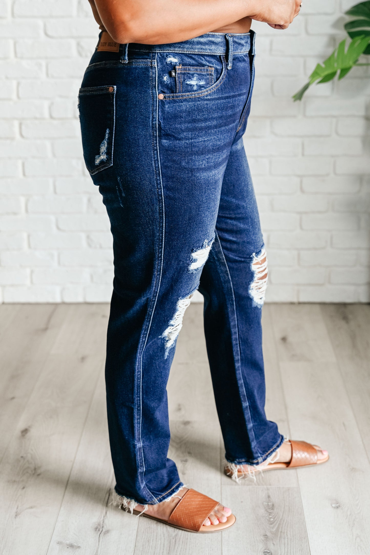 Experience the perfect blend of comfort and style with our Montana High Rise Rigid Magic Distressed Straight Jeans from Judy Blue! The high rise design and rigid magic construction provide a relaxed and flattering fit, while the dark wash and distressed details add a bit of edginess. Complete your look with these effortlessly cool jeans.