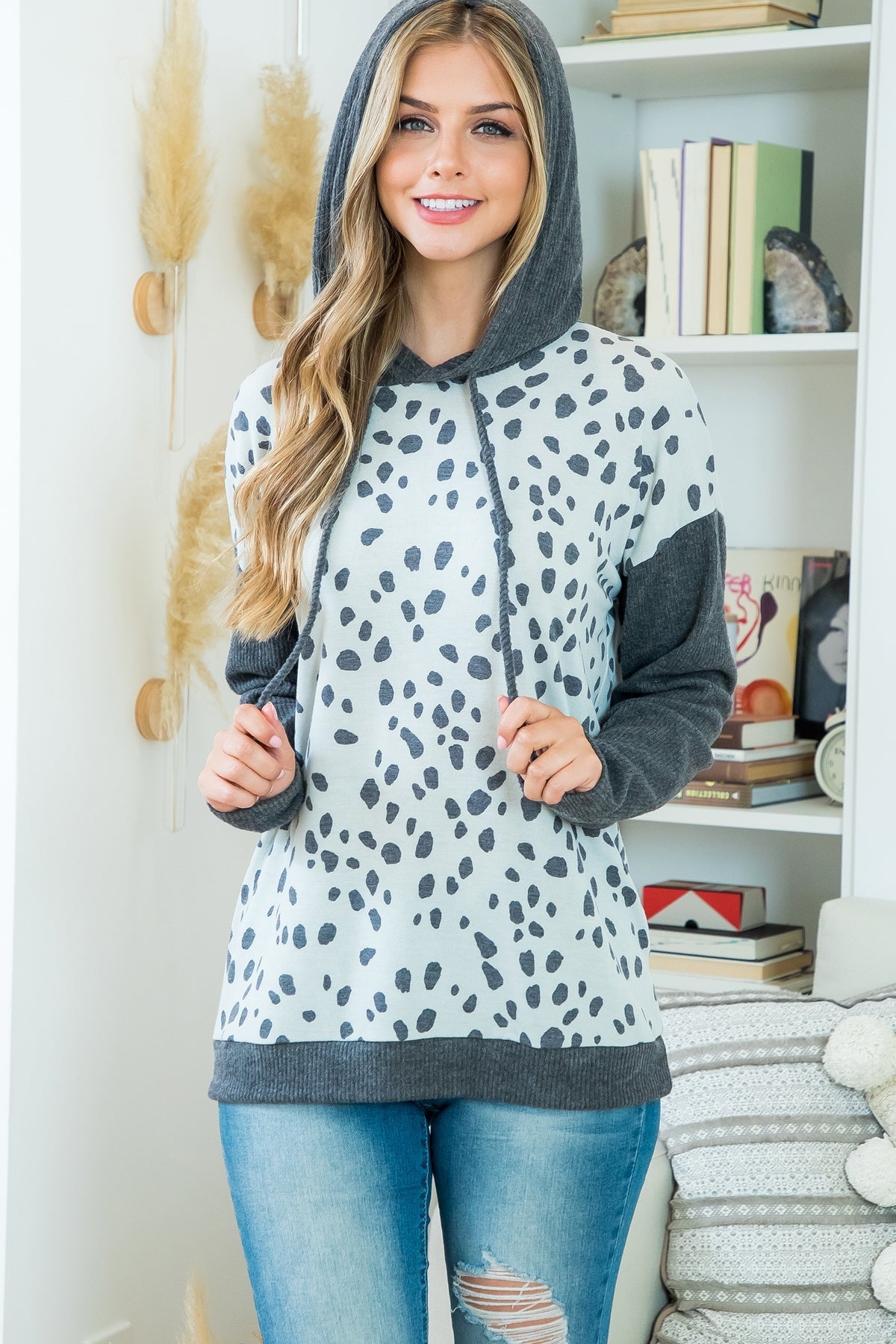 This is a long sleeve hooded top with charcoal animal print. Sizes small through x-large.