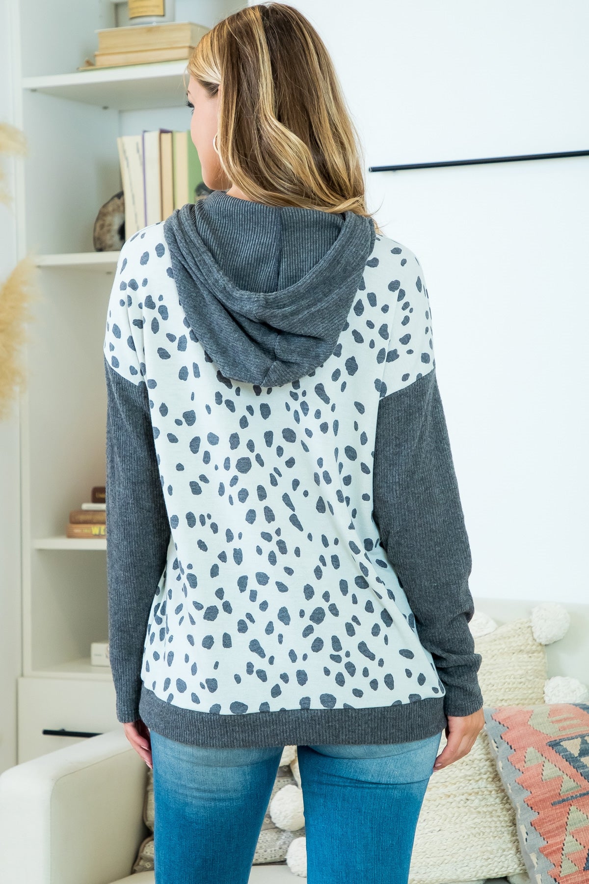 This is a long sleeve hooded top with charcoal animal print. Sizes small through x-large.