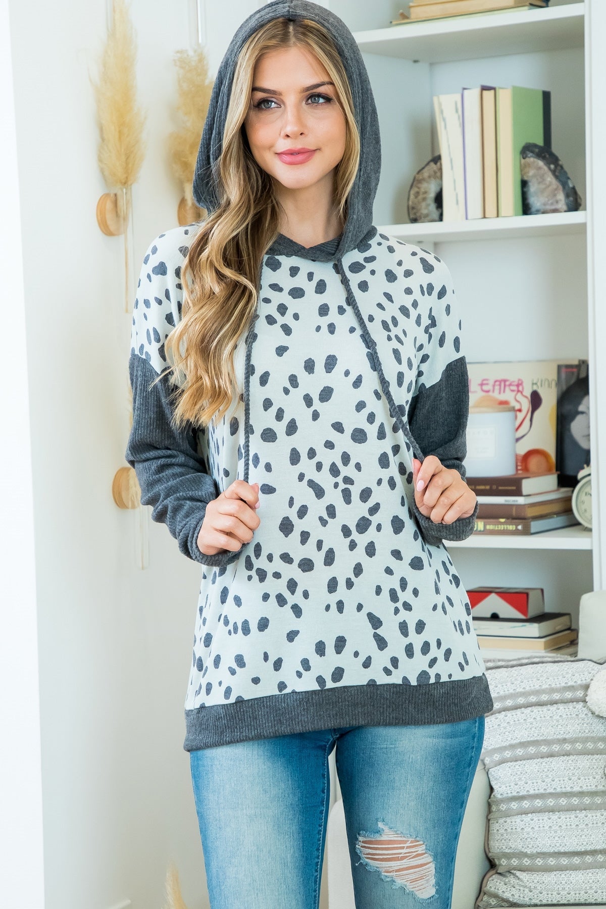 This is a long sleeve hooded top with charcoal animal print. Sizes small through x-large.