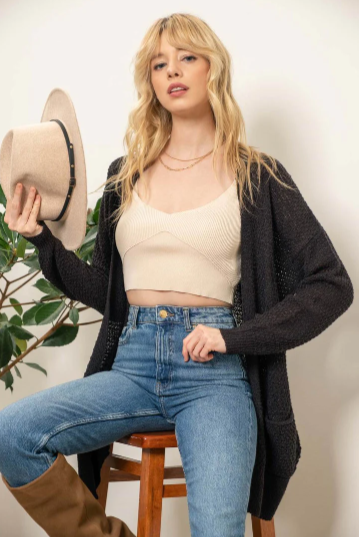 Meet Lizzy – the lightweight, pocket-equipped cardigan designed to keep you warm with style. She's an undercover superhero of sorts, blending effortlessly into any wardrobe and helping you save the day whenever the temperature drops! Perfect for those days when you need an extra layer but don't want the bulk.