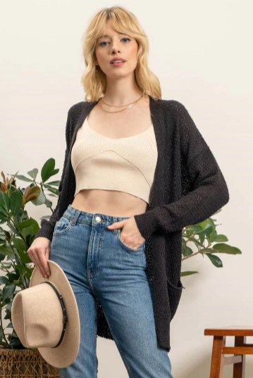 Meet Lizzy – the lightweight, pocket-equipped cardigan designed to keep you warm with style. She's an undercover superhero of sorts, blending effortlessly into any wardrobe and helping you save the day whenever the temperature drops! Perfect for those days when you need an extra layer but don't want the bulk.