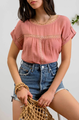 Add a touch of whimsy to your wardrobe with our "Paradise Dusty Apricot" lace top! Featuring round neck and classic lace trim, plus a button tab sleeve and short sleeve, you'll feel like you're in a floral-filled wonderland. (Oh yeah!) So, bring on the romance!