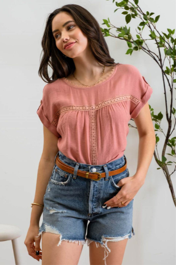 Add a touch of whimsy to your wardrobe with our "Paradise Dusty Apricot" lace top! Featuring round neck and classic lace trim, plus a button tab sleeve and short sleeve, you'll feel like you're in a floral-filled wonderland. (Oh yeah!) So, bring on the romance!