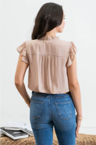 Freshen up your wardrobe with the "Faith Light Mocha" top! With split neckline, flutter sleeves, and lace detail, this top is perfect for any occasion. And tie it with a cute neck tie for an extra WOW factor. Be bold, be beautiful, and stay full of faith!