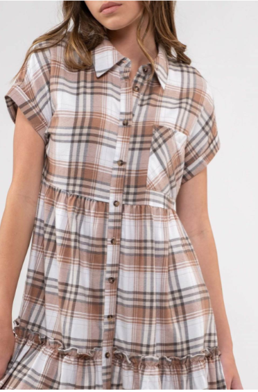 Rock your modern-meets-rustic side in this plaid mini dress! Featuring a collared neckline with button down closure, cinched waist, and a ruffle hem, you'll look fly af (as fashionable) no matter the occasion. With pocket detail, this pleated plaid piece will have you looking cute and stylish all day - yesssss girl! Sizes small through large.
