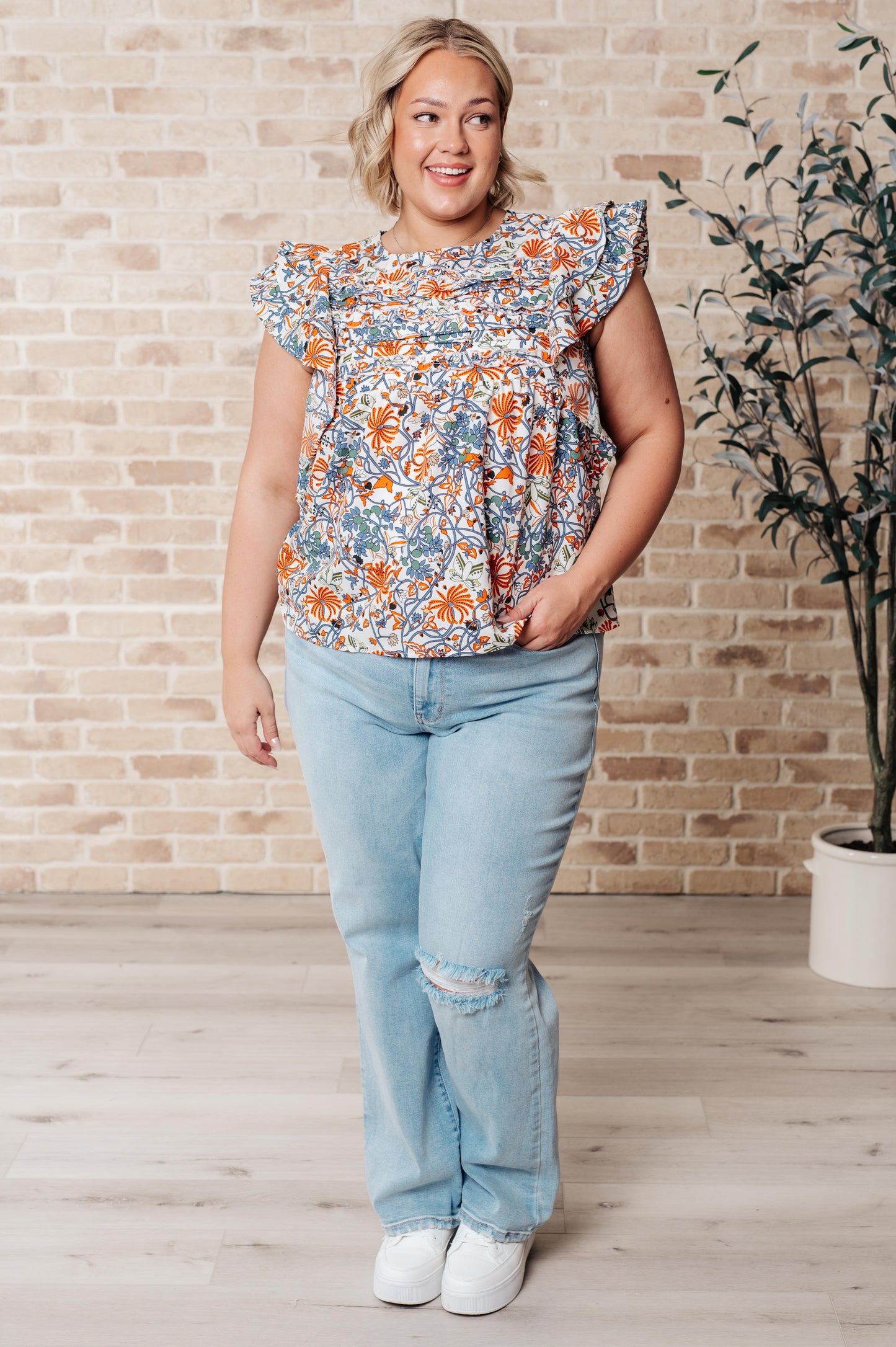 Embrace your inner zen with our Something Peaceful Flutter Sleeve Blouse! Crafted from a beautiful woven fabric, its rounded neckline and layered flutter sleeves bring a sense of calm and femininity. The horizontal pintuck details and keyhole closure add a touch of whimsy. s-3x