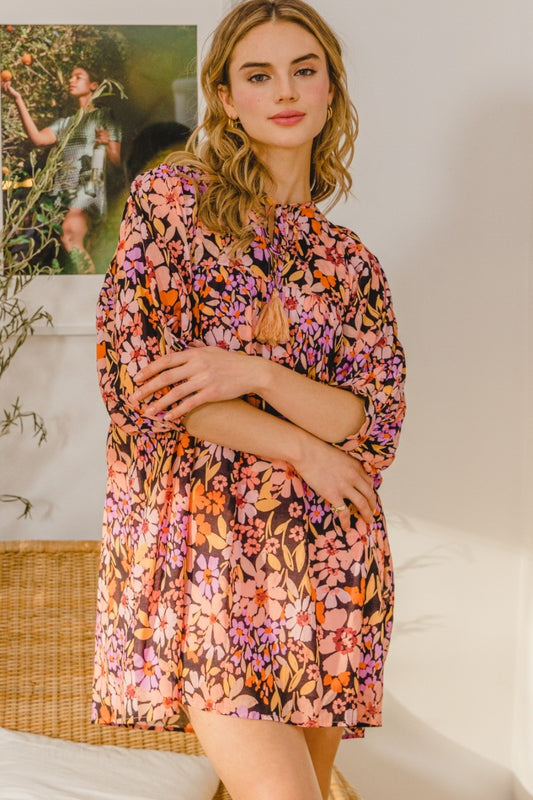 The Floral Tied Neck Mini Dress is a charming and feminine choice for any occasion. Its floral pattern adds a touch of elegance, while the tied neck detail offers a lovely and unique feature. This mini dress is perfect for a summer day out or a special event where you want to stand out.  s-3X