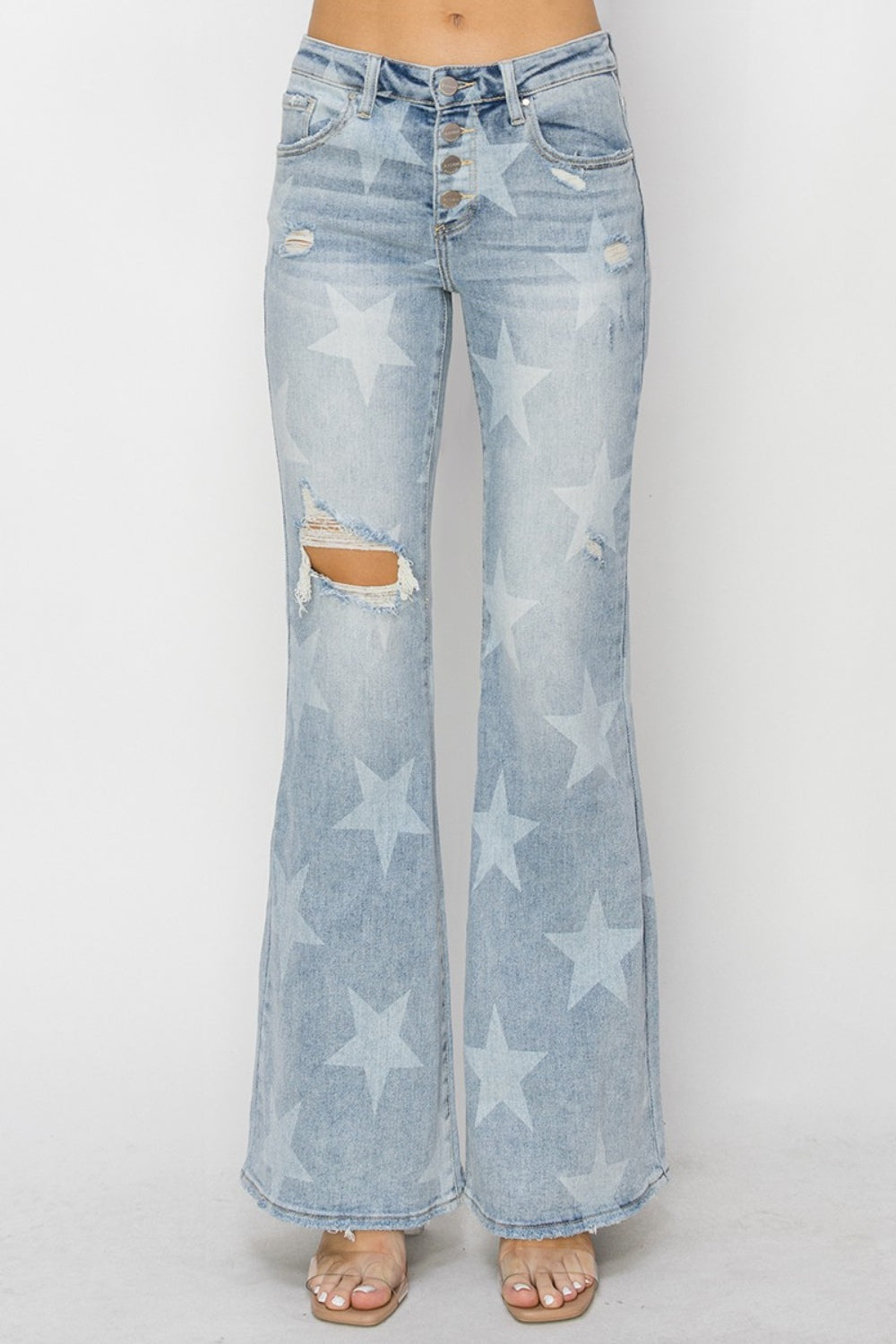 These Mid Rise Button Fly Star Print Flare Jeans are a unique and trendy addition to your denim collection. The mid-rise fit offers a flattering and comfortable silhouette, while the button fly adds a touch of vintage charm.  0 -15