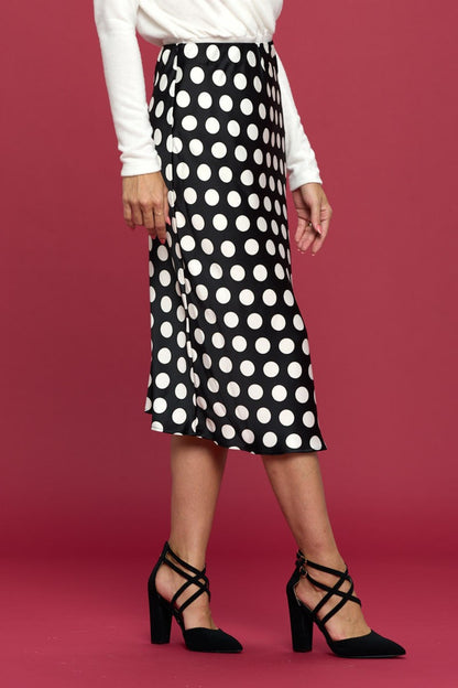 This polka dot satin midi skirt is a timeless and versatile piece that exudes elegance and charm. The classic polka dot print adds a playful and stylish touch to the skirt, perfect for adding a fun element to your outfit.  S  - L