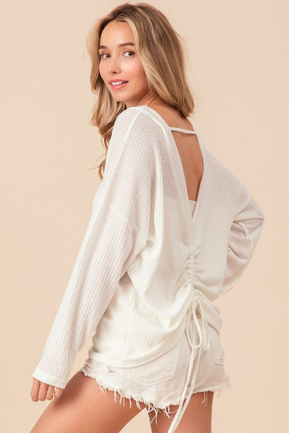 The Waffled Backless Drawstring Top is a flirty and stylish choice for your summer wardrobe. Featuring a waffled texture, this top adds depth and interest to your look. The backless design with a drawstring detail creates a playful and alluring silhouette.  S - XL