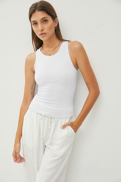 Introducing our Round Neck Wide Strap Tank, a versatile and essential piece for your wardrobe! This tank top features a classic round neckline and wide straps for a comfortable fit. Made from soft and stretchy fabric, it provides a flattering and effortless silhouette. S  - L