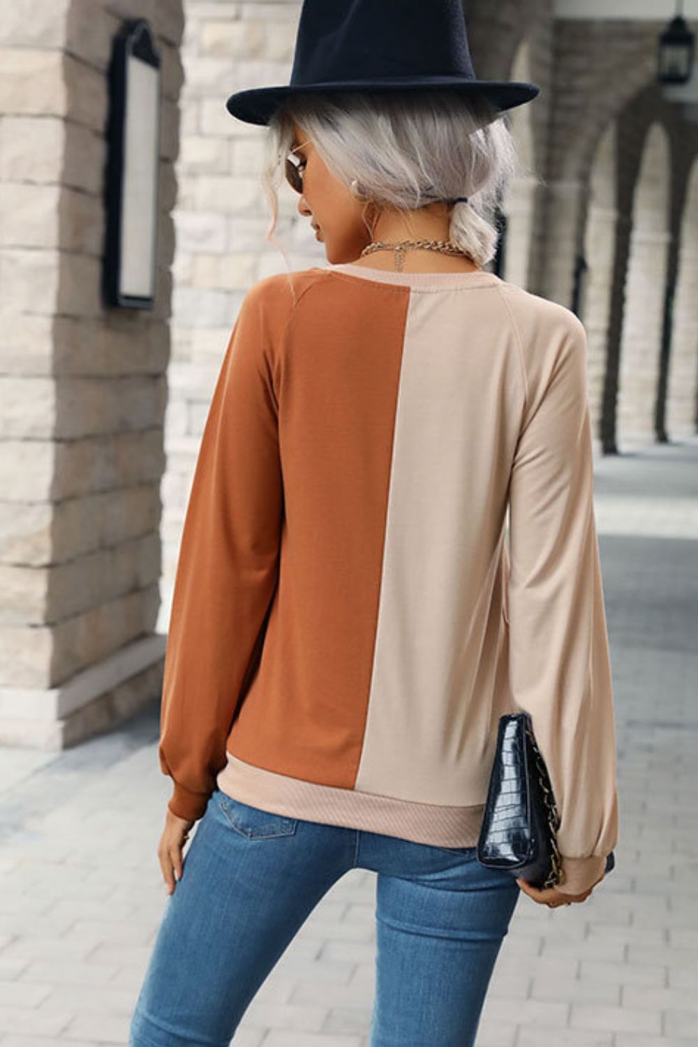 “Seeing Double” is a long sleeve sweatshirt featuring coloring blocking, round neckline, raglan sleeves, cuffed sleeves and hemline.The colors are khaki and brown. Sizes small through x-large.