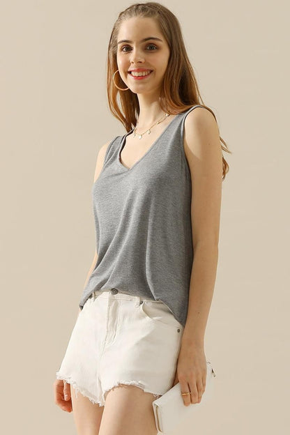 The V-Neck Curved Hem Tank is a stylish and versatile piece. With its flattering neckline and curved hem, it adds a touch of femininity to any outfit. The tank's relaxed fit provides comfort without sacrificing style. S - 3X