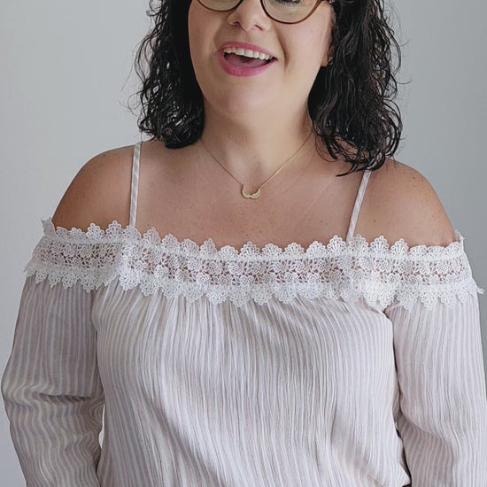 Unleash your playful side with this adorable top! This tan and off-white top features delicate lace trim and a fun bubble silhouette, making it perfect for any occasion. Embrace a unique and quirky style with this statement piece. Sizes small through large.