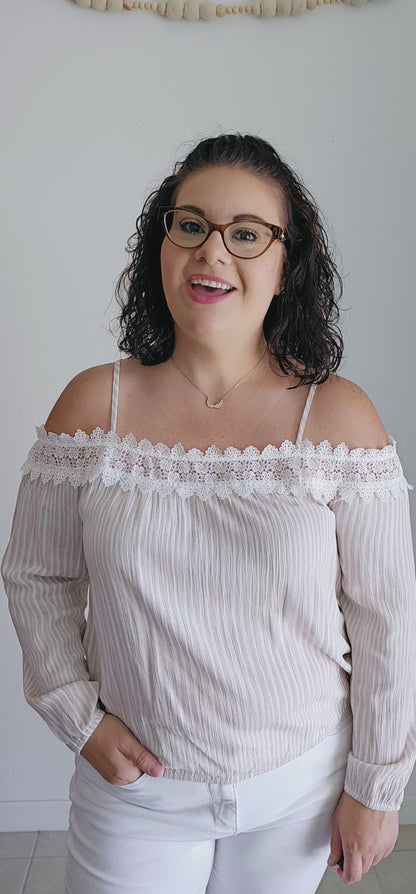 Unleash your playful side with this adorable top! This tan and off-white top features delicate lace trim and a fun bubble silhouette, making it perfect for any occasion. Embrace a unique and quirky style with this statement piece. Sizes small through large.