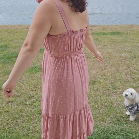 Look oh-so-stylish in this "Lily Dusty Rose Polka Dot" midi dress! With its square neckline, sleeveless design and tie straps, this dress is everything your summer wardrobe needs. The midi length and tiers give you the perfect shape for any occasion. Let the fun begin! Sizes small through large.