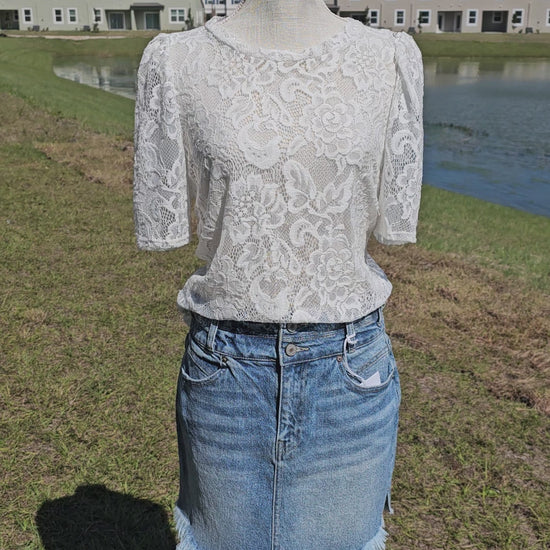 “All About The Lace” is a gorgeous white lace top. This is a short sleeve shirt, featuring floral lace print, bubble sleeves, rounded neckline and hemline. It does have stretch! Pair with your favorite cami or bralette. Sizes small through large.