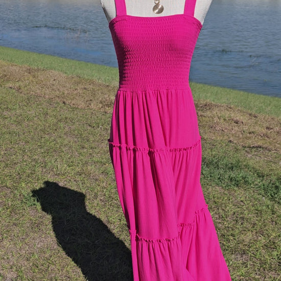 Pink smocked tiered midi dress, square neck, smocked top, wide straps. Sizes small through x-large.