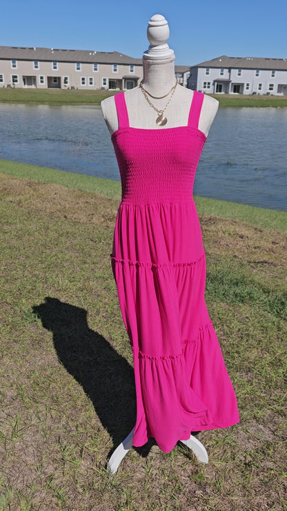 Pink smocked tiered midi dress, square neck, smocked top, wide straps. Sizes small through x-large.