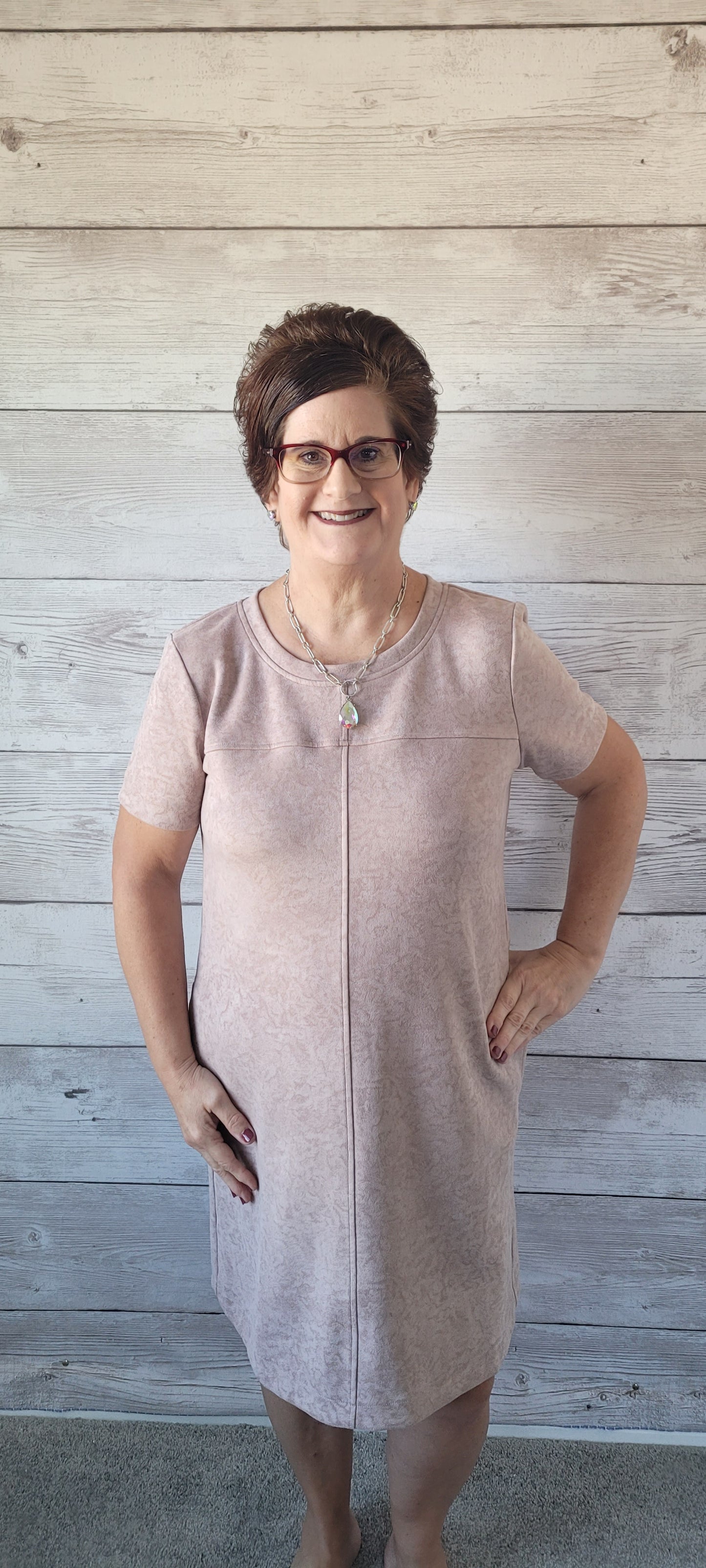Dress to impress in this "Winona Mauve Printed Suede Shift Dress" and show off your country flair! With its round neckline, short sleeves, side pockets, and zipper back closure, it’s sure to be your go-to look for any special occasion. Yee-haw! Sizes small through large.