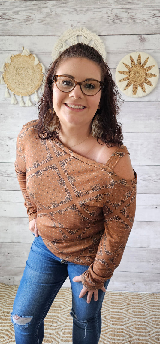 This top features one cold shoulder with strap, long sleeves, with bandana print.  Light weight and breathable. Go ahead and wear it line dancing, to the rodeo, hanging out with your friends, or just running errands.  You know that you want to give it a try! Sizes small through x-large.