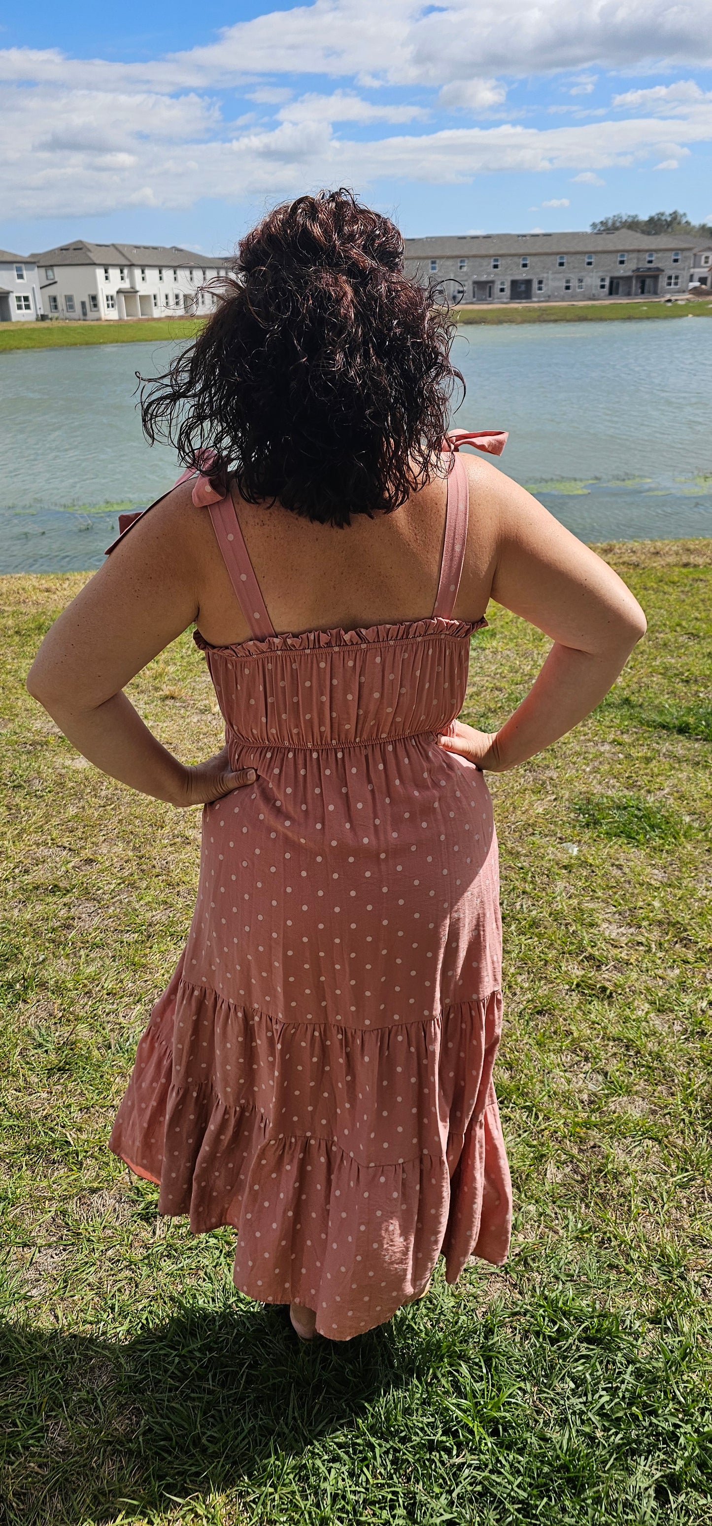 Look oh-so-stylish in this "Lily Dusty Rose Polka Dot" midi dress! With its square neckline, sleeveless design and tie straps, this dress is everything your summer wardrobe needs. The midi length and tiers give you the perfect shape for any occasion. Let the fun begin! Sizes small through large.