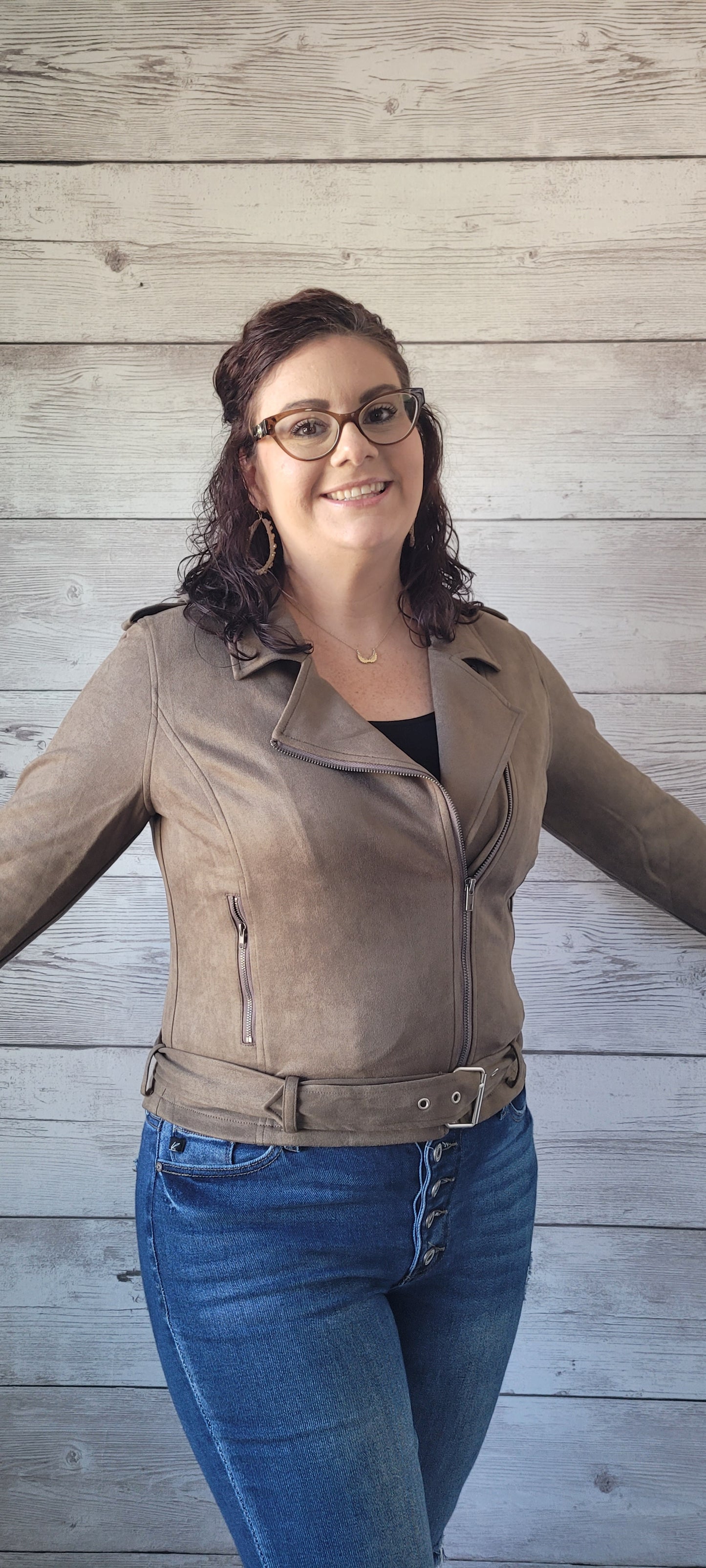 Feel cool and edgy with the "Tessa Olive Faux Suede Biker Jacket"! This classic style features zippered side pockets and waist belt to add a little bit of flavor to your look. With a zipper front closure, you'll be ready to rock n roll in no time! Look sharp, get wild, and ride off into the sunset in style! Sizes small through large.