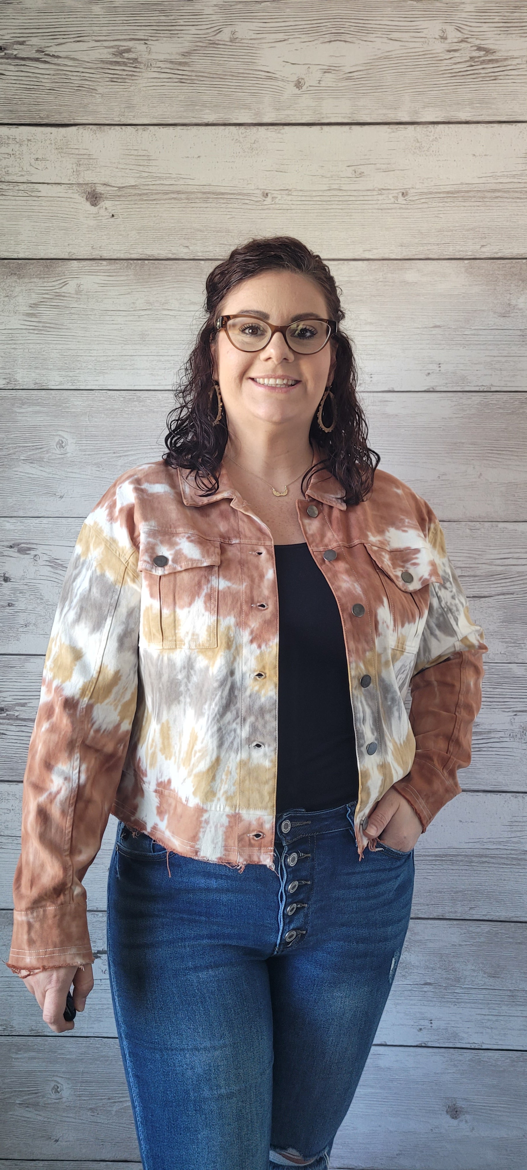 Make a statement with this adorable terracotta tie dye trucker jacket! Enjoy the unique style of this timeless piece featuring metal button closure, bust flap pockets, and distressed hem and cuff edges. Wearing this piece is sure to cause a stir; try it and let the compliments roll in! Sizes small through large.