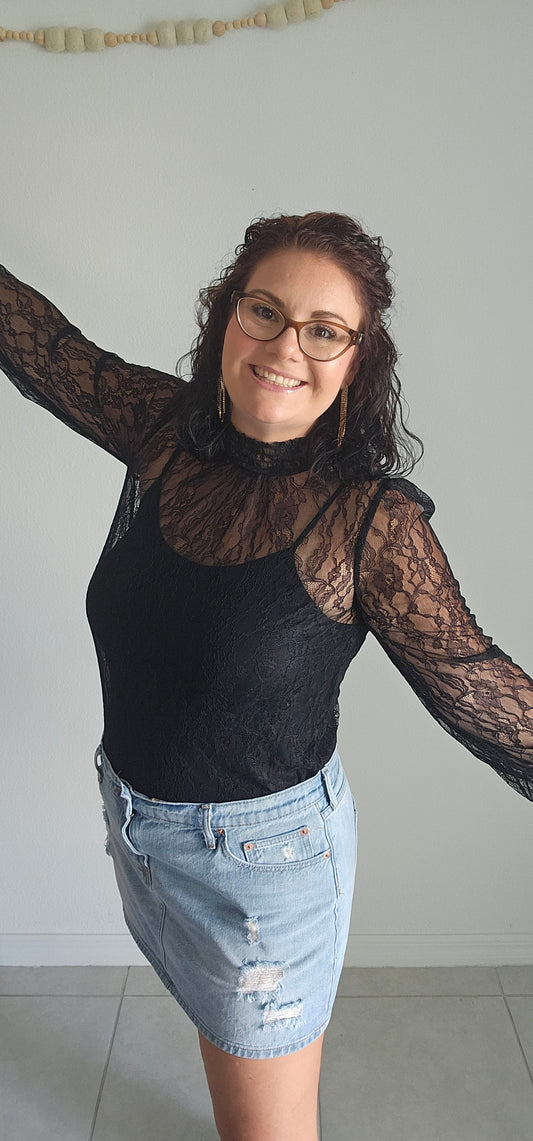 Look luxe and fabulous in the "Lainey Black Mesh Lace Long Sleeve Top" - complete with a elastic mock neck, elastic cuffs, and a beautiful floral pattern! And if you're feeling extra daring, you can even pair it with a bodysuit for a sassy look sure to turn heads! Sizes small through large.