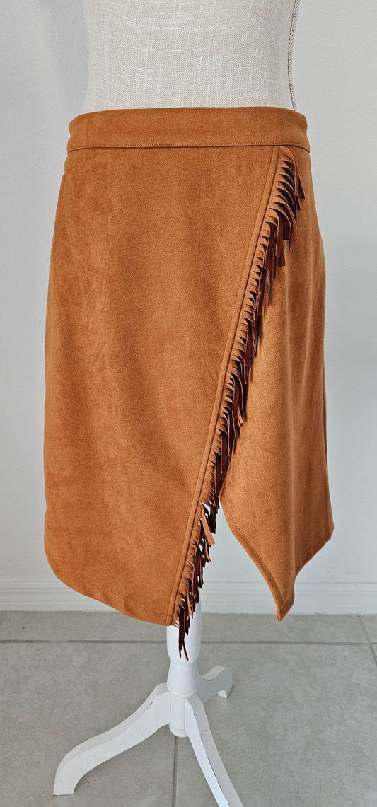 This wrap skirt features fringe accents. Pair it with your favorite top and heels for an effortless look. Size x-large.