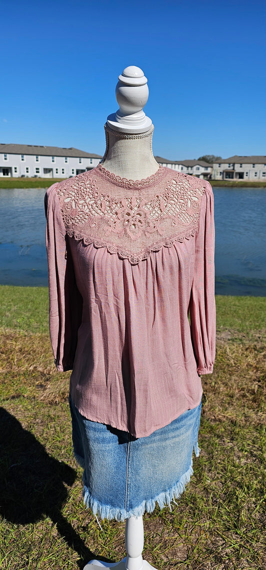 Rock your look with this ravishing top that'll take your fashion to the next level! With its elegant lace mock neck, stylish back-button closure with keyhole, and oh-so-pretty front lace inset and pleated bubble sleeves, you'll be sure to draw admiring glances wherever you go. Let's get fabulous! Sizes small through large.