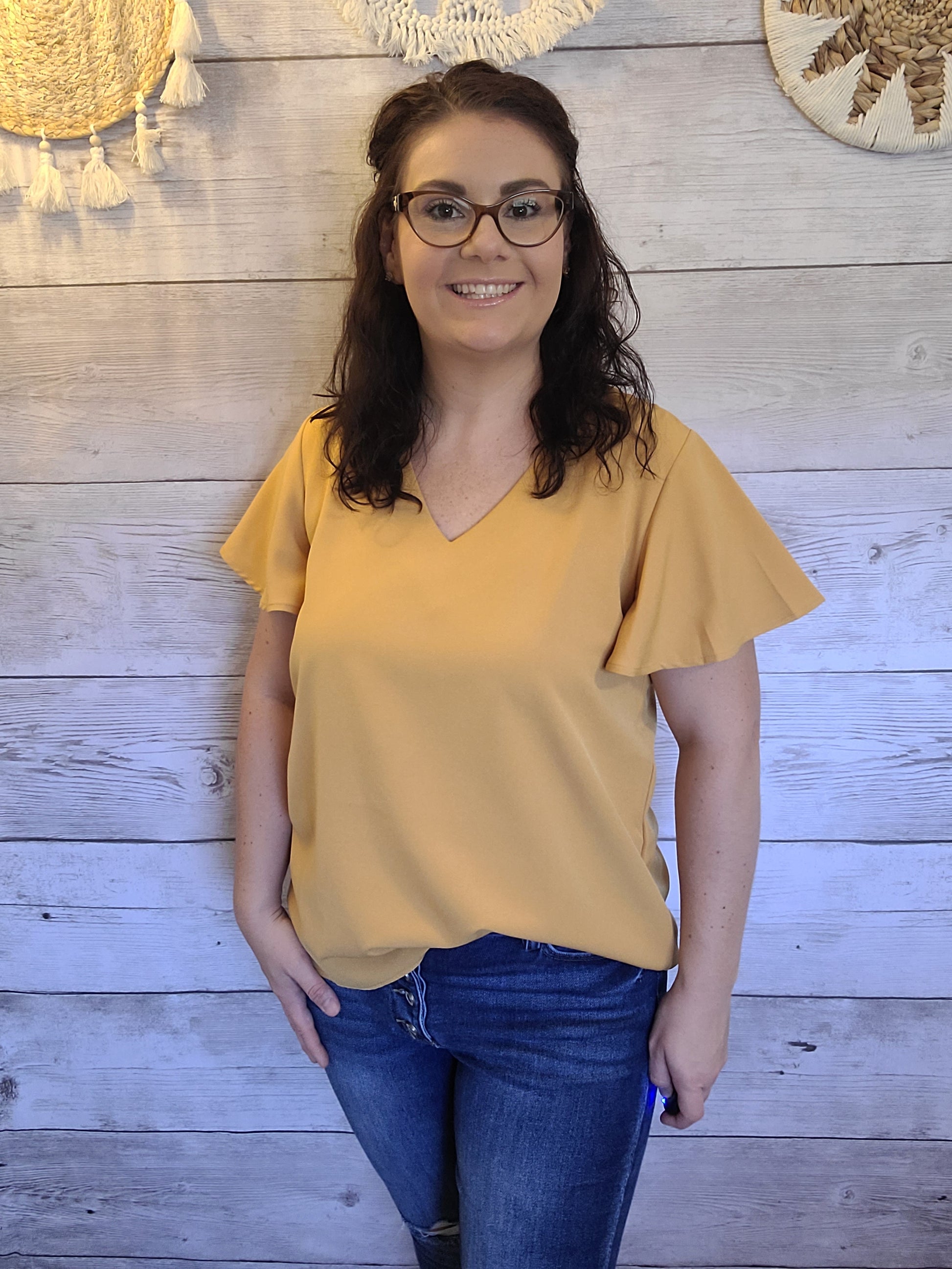 Harvest some style in this Dandelion Fields Golden Mustard Top! Featuring a woven flutter sleeve v-neck - it's the perfect outfit choice to spice up any look! Guaranteed to make you stand out like a ray of sunshine. Sizes small through x-large.