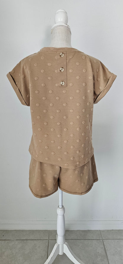 Stay chic and comfy in this&nbsp;adorable lounge set&nbsp;with swiss dots! These cute shorts and short sleeves will have you lounging in style (in a jiffy!). Whether you’re working from home or just kicking back, you’ll be the queen of the living room! Sizes small through large.