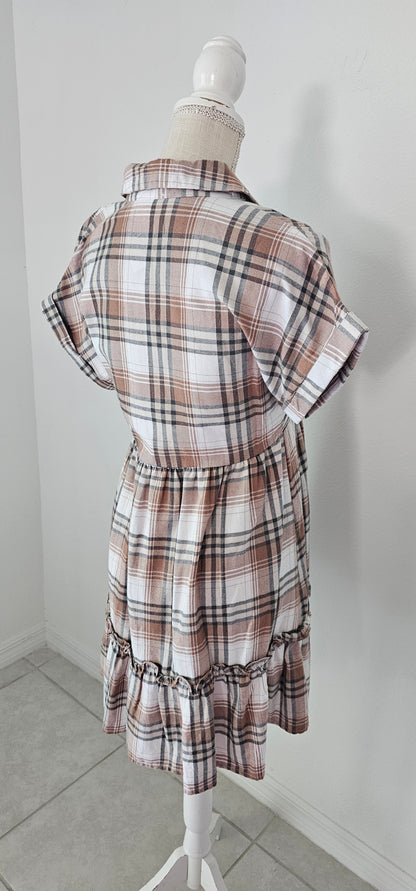 Rock your modern-meets-rustic side in this&nbsp;plaid&nbsp;mini dress! Featuring a collared neckline with button down closure, cinched waist, and a ruffle hem, you'll look fly af (as fashionable) no matter the occasion. With pocket detail, this pleated plaid piece will have you looking cute and stylish all day - yesssss girl! Sizes small through large.