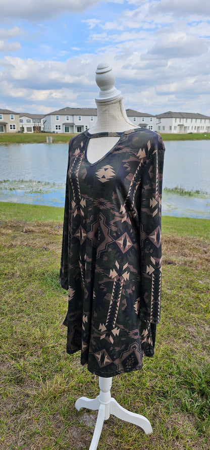 This dress features an Aztec design, key hole cut-out neckline, long sleeves, roomy and comfy. It has pockets! The colors are a camouflage.  Imagine yourself wearing this cute number to the rodeo, going out on the town, hanging out with family and friends, you will be comfortable however you choose to wear your dress. Sizes small through x-large.