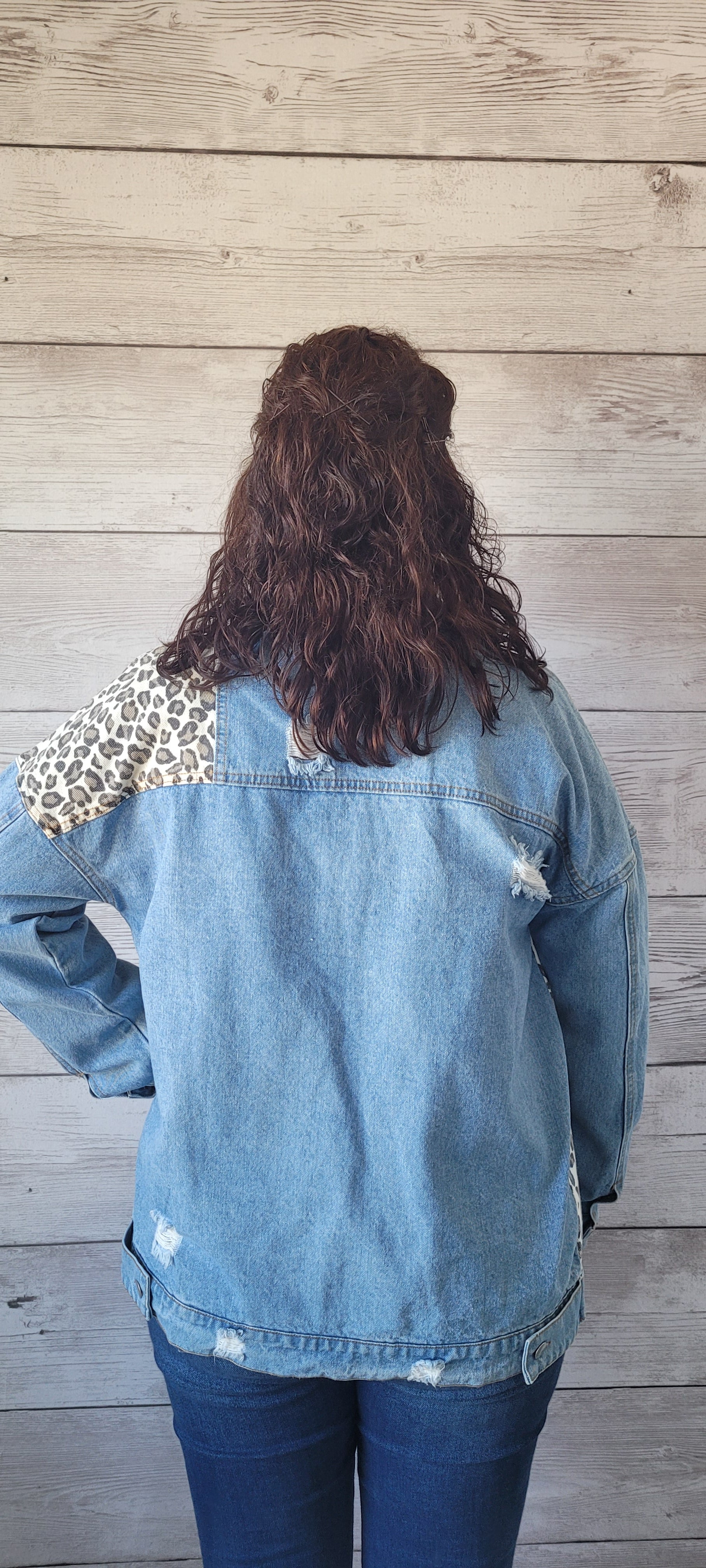 This is a perfect staple piece for everyday wear on those cool days. Imagine yourself in this unique and cute jean jacket. "Blue Jean Baby" features a leopard print throughout, with a distressed look, buttons down the front and on the sleeve cuffs. This is a light wash denim that offers pockets on the front. Sizes small through large.
