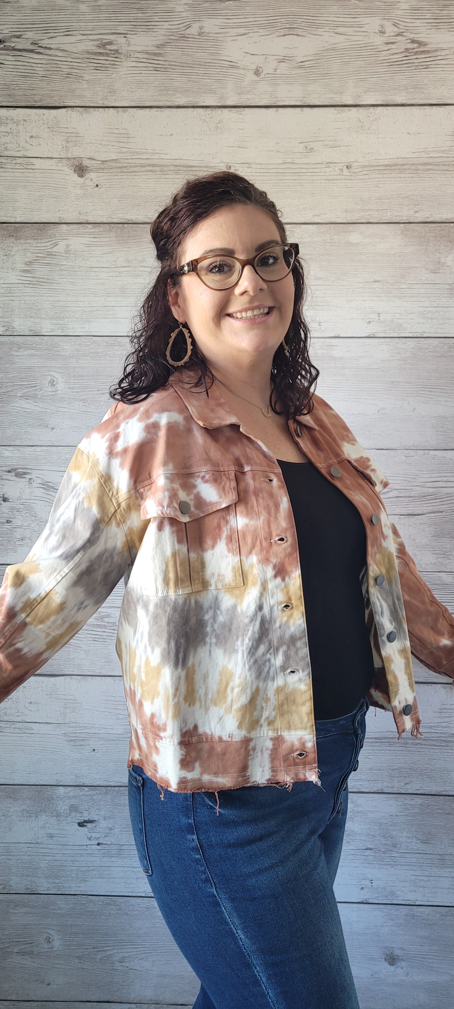 Make a statement with this adorable terracotta tie dye trucker jacket! Enjoy the unique style of this timeless piece featuring metal button closure, bust flap pockets, and distressed hem and cuff edges. Wearing this piece is sure to cause a stir; try it and let the compliments roll in! Sizes small through large.