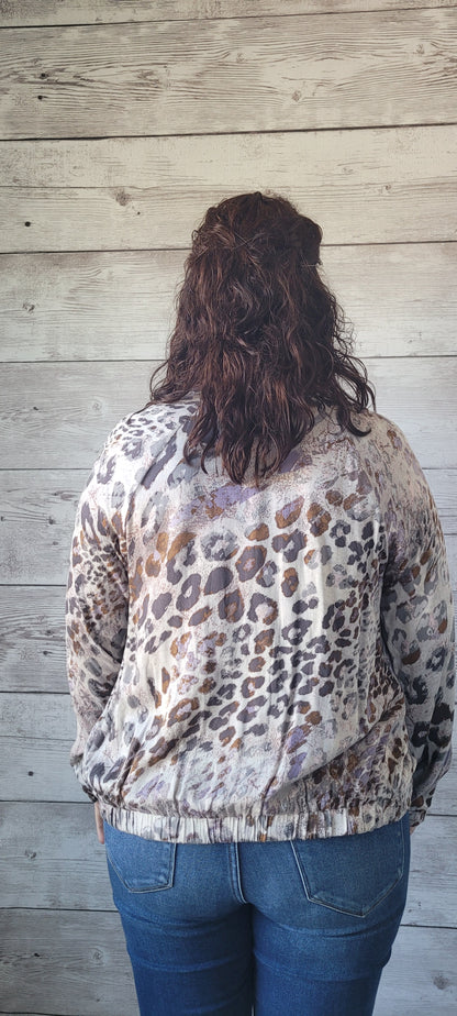“Feeling Fabulous” is a lightweight leopard print bomber jacket. This jacket features a zip up front, two functional side pockets, ribbed collar, elastic cuffs and waistband. The colors are mauve, light and dark gray, and camel. Sizes small through large.