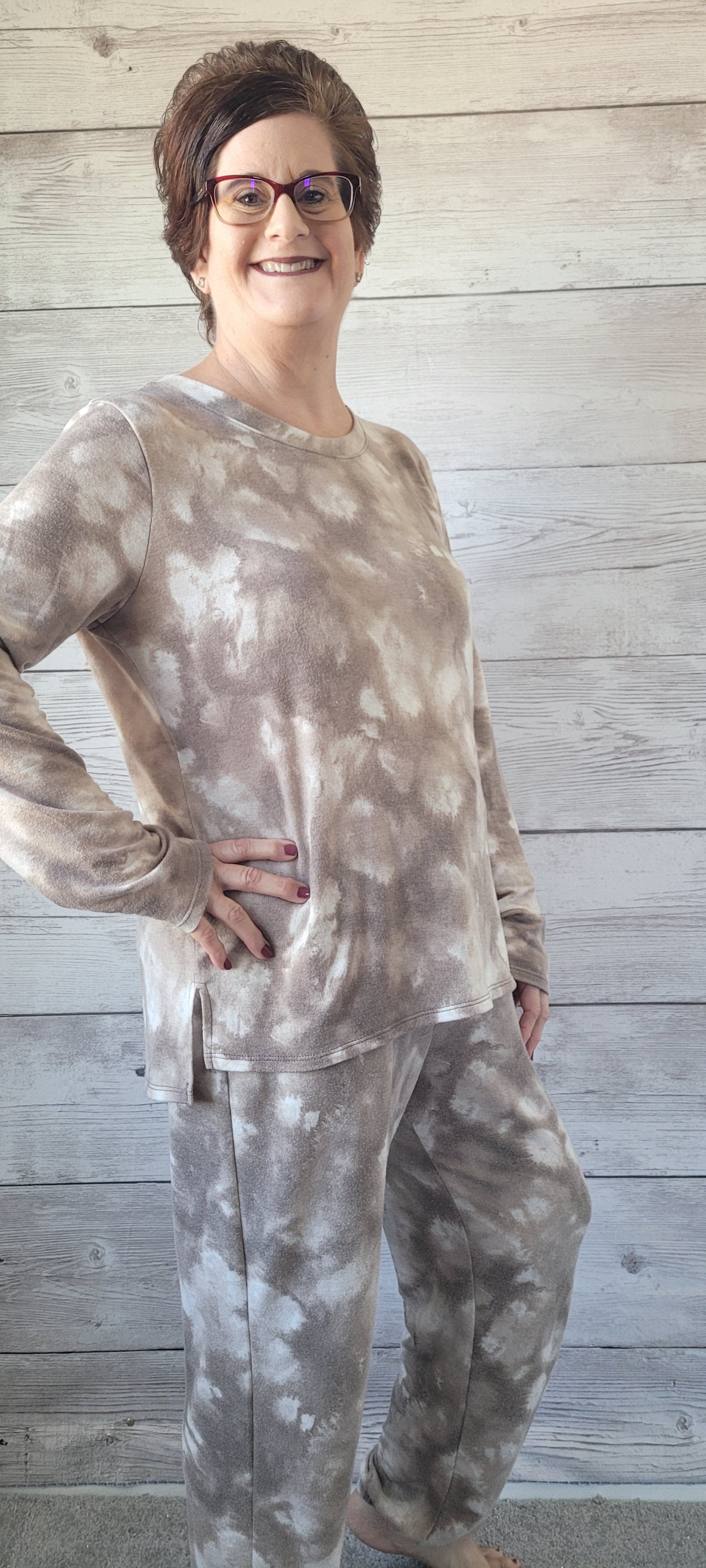 Rock this season in style! Our Daniela Mocha Tie Dye Lounge Set is crafted with delightful french terry fabric for a comfortable look. The pullover has a rounded neckline and eye-catching side slits detail, while the jogger pants feature double pocket details and a waist drawstring. Perfect for lounging or running around town. Slip into something more you! Sizes small through large.