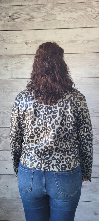 This leopard jacket features two side zippers on front, the main zipper with folded over front, four belt loops for the little added feature, along with eyelet buttons for professional detailing. This adorable jacket is very soft and lightweight . Go ahead and take a walk on the wild side before it's gone. Sizes medium through x-large.
