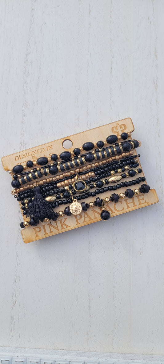 Pink Panache bracelet 10-strand black mix bead curvy bracelet with 8mm bronze/black cushion cut drop and tassel Limited supply!