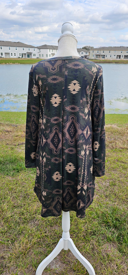 This dress features an Aztec design, key hole cut-out neckline, long sleeves, roomy and comfy. It has pockets! The colors are a camouflage.  Imagine yourself wearing this cute number to the rodeo, going out on the town, hanging out with family and friends, you will be comfortable however you choose to wear your dress. Sizes small through x-large.