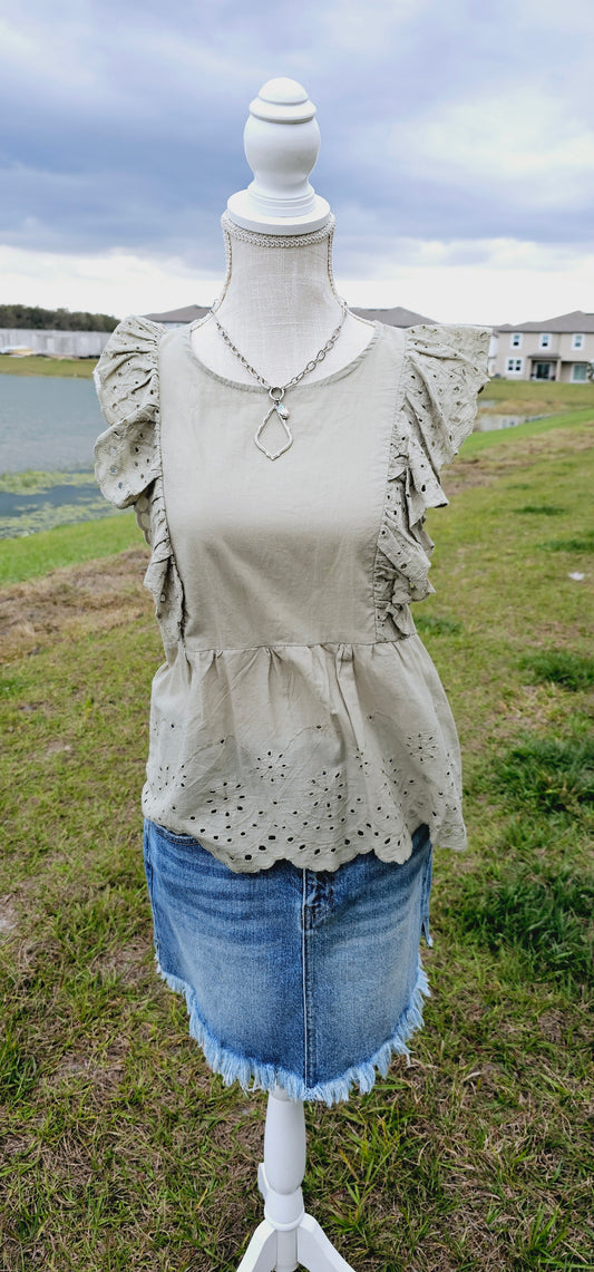 Shhh! Don’t tell anyone, but I like you! “Secret Crush” features ruffled lace trim short sleeves with eyelet design, scalloped hemline, keyhole back with button enclosure, and rounded neckline. This top is great for vacation, those hot summer days, or a shopping day with your friends. Sizes small through large.