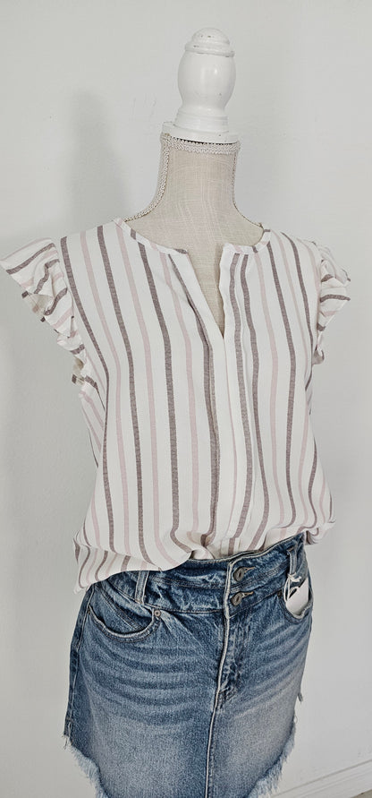 Look as sweet as a summer's day in this "Heather Striped Taupe" top! With cute flutter sleeves, a split round neckline, and a playful front-fold detail, you'll be ready for any outdoor adventure! And just to top it off, the taupe stripes add an extra bit of pizzazz. Who said stripes have to be boring?! Size small through large.